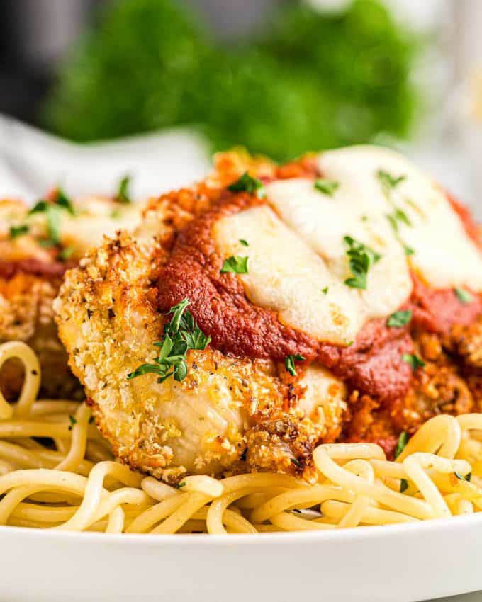 chicken parmesan on top of spaghetti