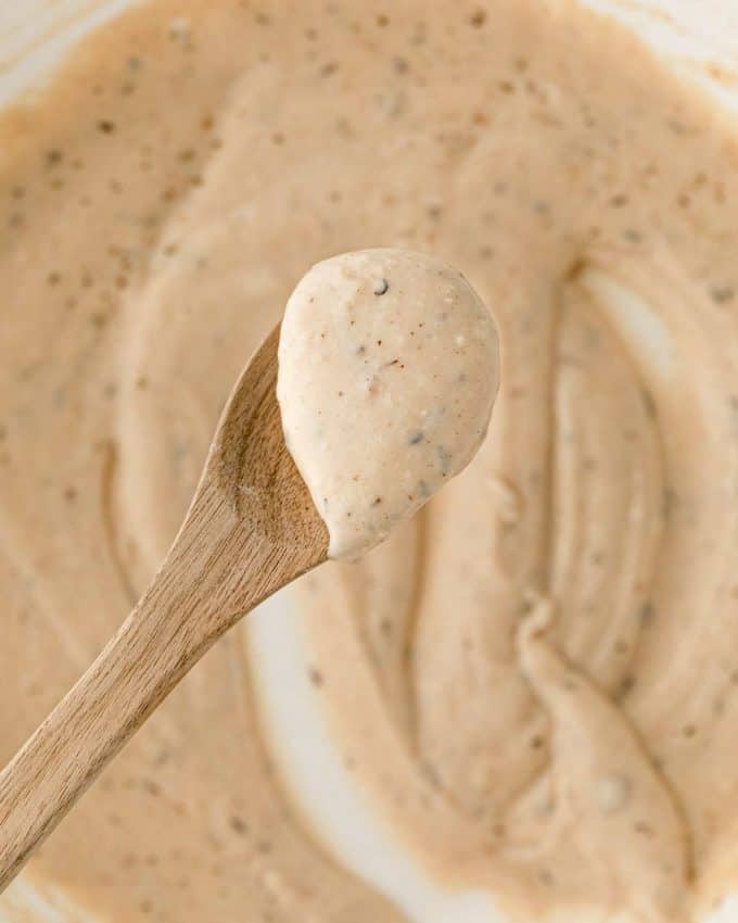 pepper gravy on wooden spoon