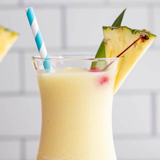 frozen pina colada with cherry garnish