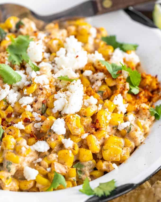 mexican street corn dip in white bowl