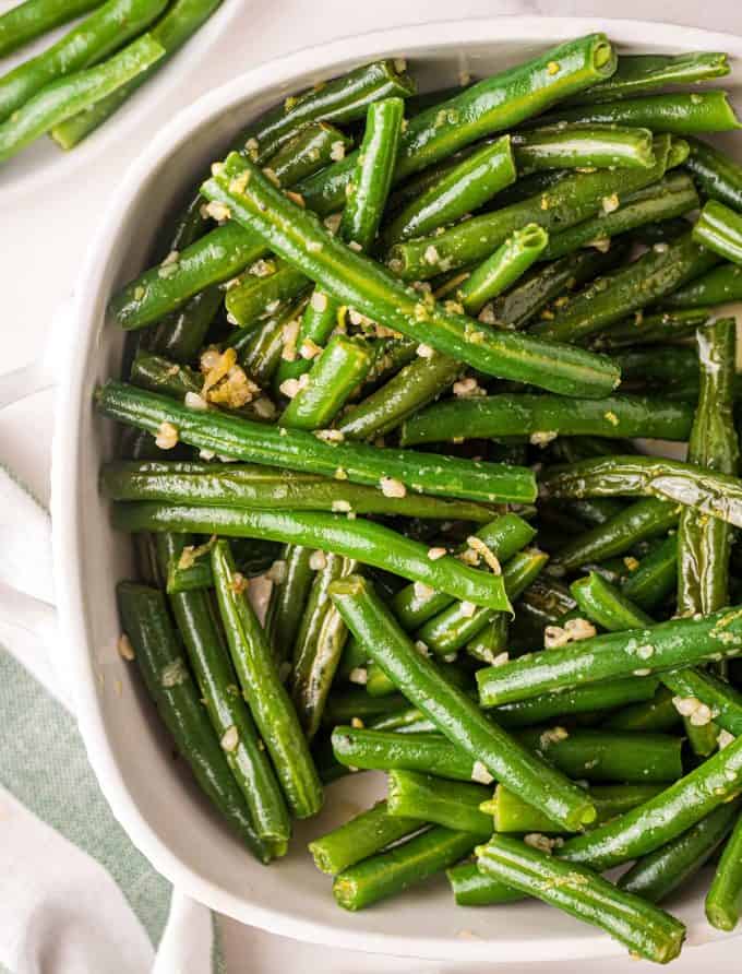 sauteed green beans in serving dish.