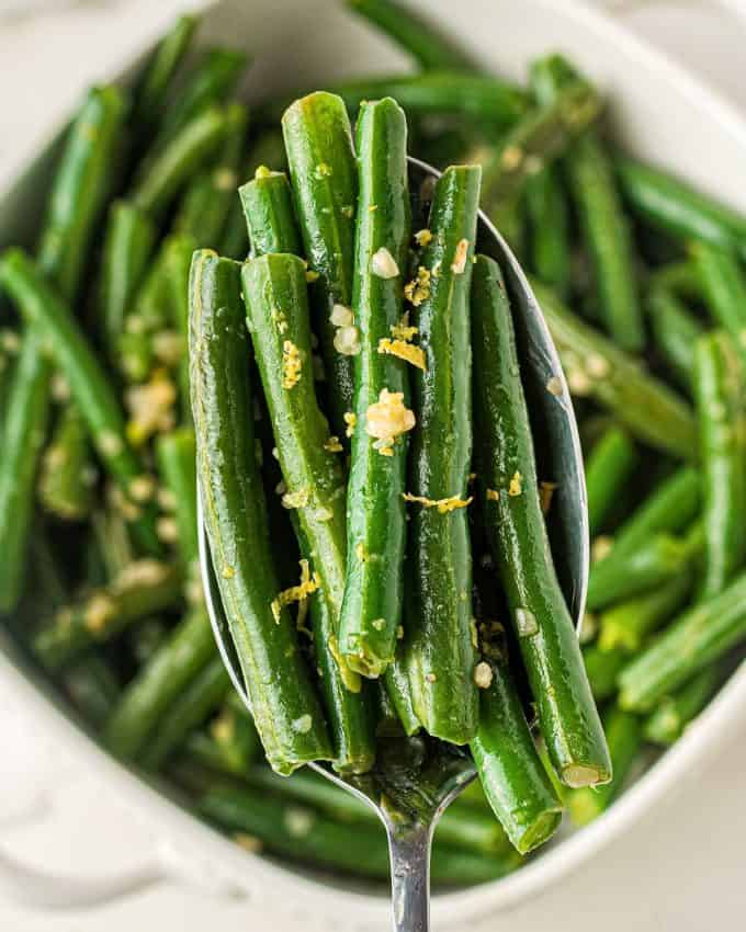 serving spoonful of fresh cooked green beans.