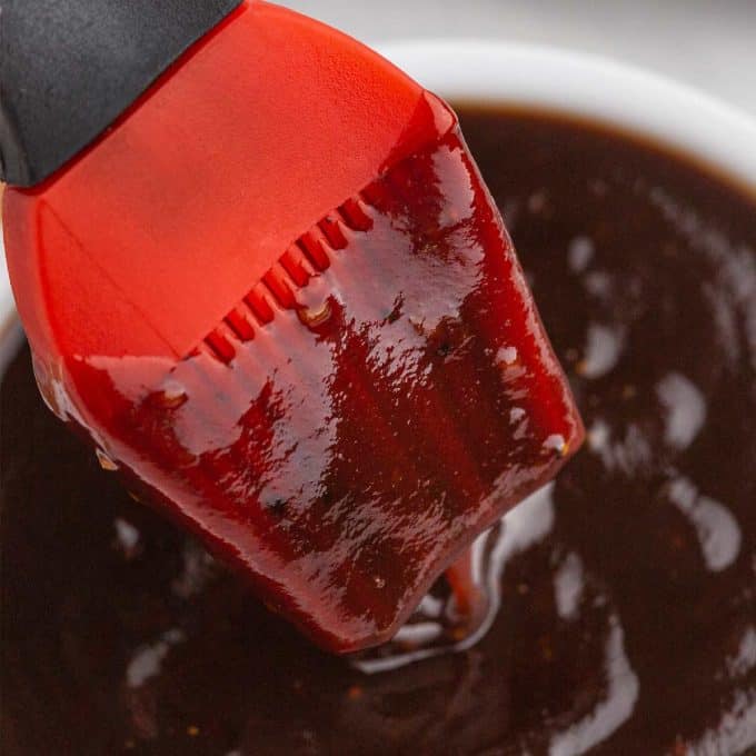 basting brush dipped in balsamic bbq sauce