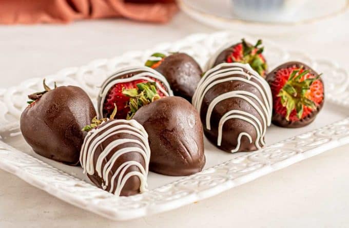 chocolate dipped strawberries on platter.