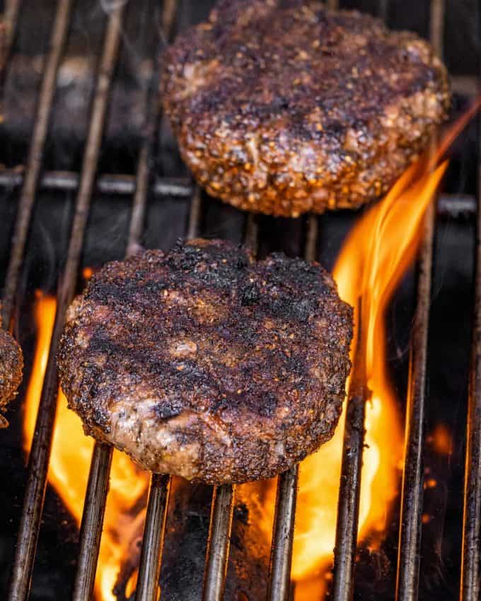 grilling hamburgers on a gas grill