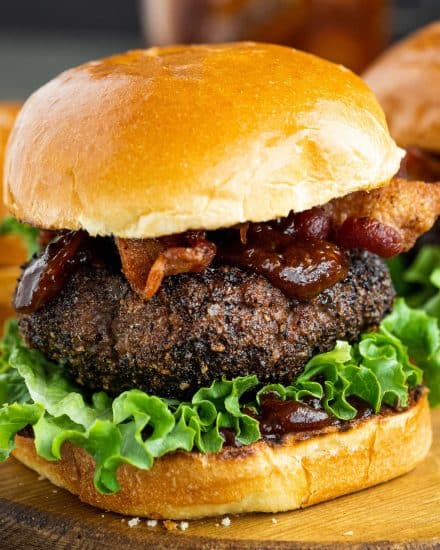 These Homemade Burgers are seasoned with a spiced coffee rub that elevates the flavor of the beef and makes for a truly epic hamburger! The cola and coffee bbq sauce just sets it apart from the rest! #burger #dryrub #grillingrecipes