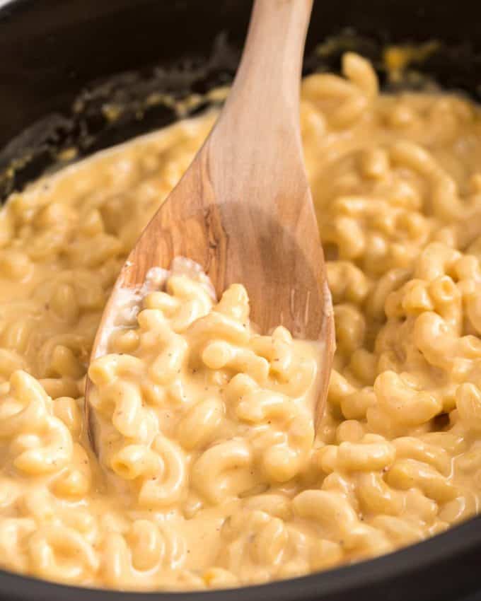 This ultra creamy Mac and Cheese recipe is made right in your slow cooker! Loved by both kids and adults, it's perfect for parties, potlucks, and more! #macandcheese #crockpot #slowcooker
