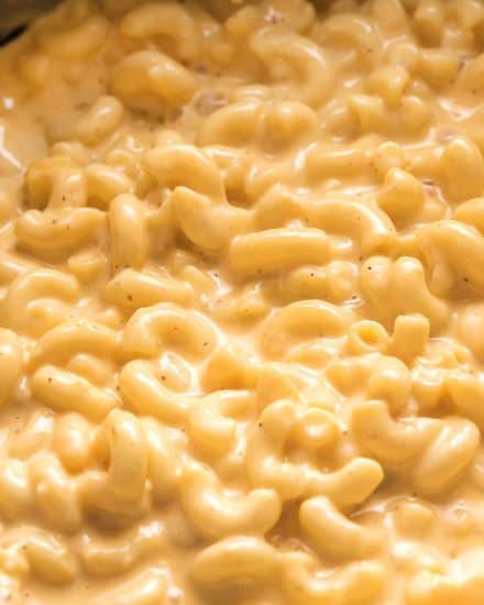 This ultra creamy Mac and Cheese recipe is made right in your slow cooker! Loved by both kids and adults, it's perfect for parties, potlucks, and more! #macandcheese #crockpot #slowcooker