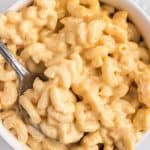 bowl of creamy mac and cheese with a spoon