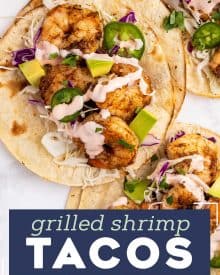 These Grilled Shrimp Tacos are smoky, a little spicy, and bursting with fresh flavors! The creamy sriracha lime sauce just takes them over the top. Easy to cook the shrimp indoors too! #tacos #shrimp #grilled