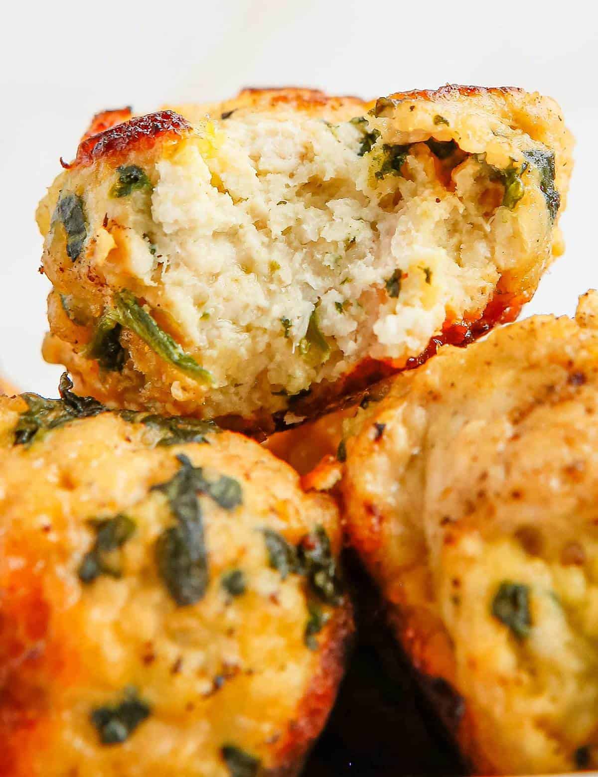Juicy and full of amazing flavor, these Spinach and Feta Turkey Meatballs are perfect for a quick weeknight dinner, a fun appetizer, or meal-prepping for lunches! Easily made in the Instant Pot, oven or on the stovetop, you'll love the succulent texture. #meatballs #feta #turkey #greek