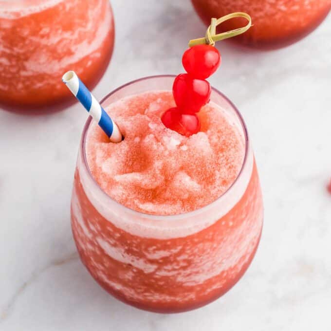 icy cherry bourbon slush in wine glass