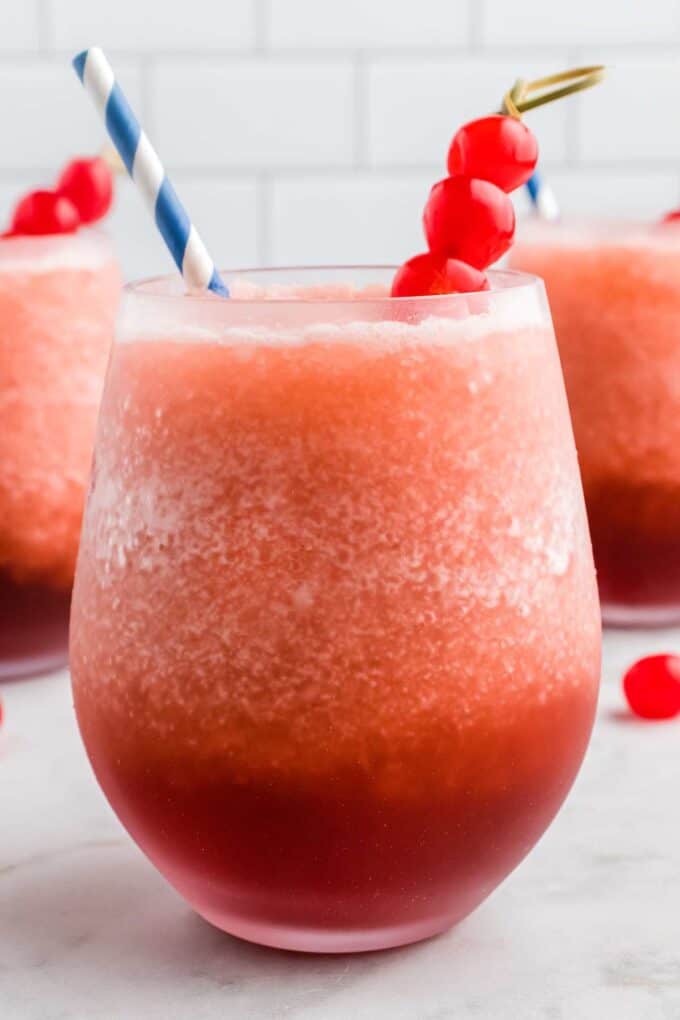 frosty glass of bourbon slush with cherries