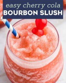 This Cherry Cola Bourbon Slush is our favorite frozen cocktail! Made with just 4 ingredients (including ice!), it's so easy to whip together and enjoy all year round! #slush #bourbon #cherry