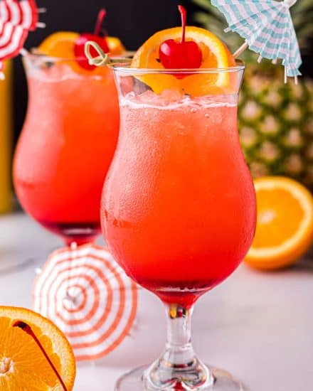 With just one sip, this Hurricane Cocktail will make you feel like you’re on an island vacation! Easy to make just a single drink, or scale it up for a party! #rum #cocktail #drink