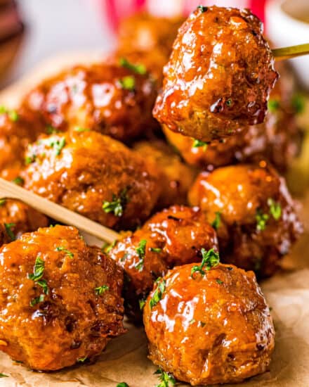 No more boring chicken meatballs! These Firecracker Chicken Meatballs are delicious on their own, but SO much better with the sweet, savory and spicy firecracker sauce! Perfect for a party or fun dinner! #appetizer #meatballs #firecracker #airfryer