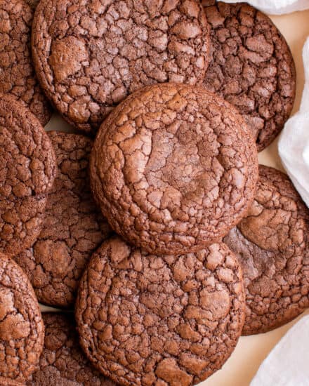 These Brownie Cookies combine all the amazing parts of a brownie; the shiny, crackly crust, chewy edges, rich fudgy centers, and great chocolate flavor... with the fun of a great homemade cookie. The best of both worlds! #brownie #cookie #baking