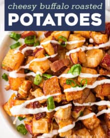 These crispy Cheesy Buffalo Roasted Potatoes are the side dish you never knew you needed in your life! Spiced potatoes, tangy hot sauce, gooey cheese, crispy bacon, fresh green onions... and top it all off with a drizzle of ranch or blue cheese dressing! #sidedish #potatoes #buffalo