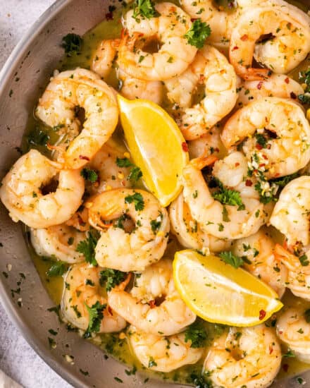 Shrimp Scampi is made with big, juicy shrimp that are cooked in a garlic butter wine sauce! Made in 20 minutes, including prep, it's perfect for a weeknight dinner. Serve with crusty bread, or over some al dente pasta! #shrimp #scampi #seafood #easydinner