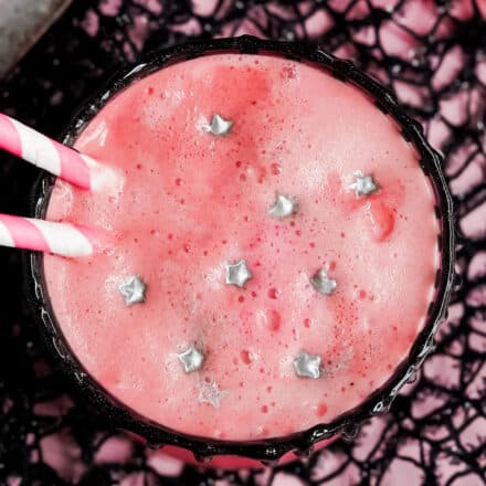 frothy top of pink witch halloween drink