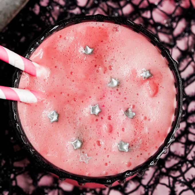 frothy top of pink witch halloween drink