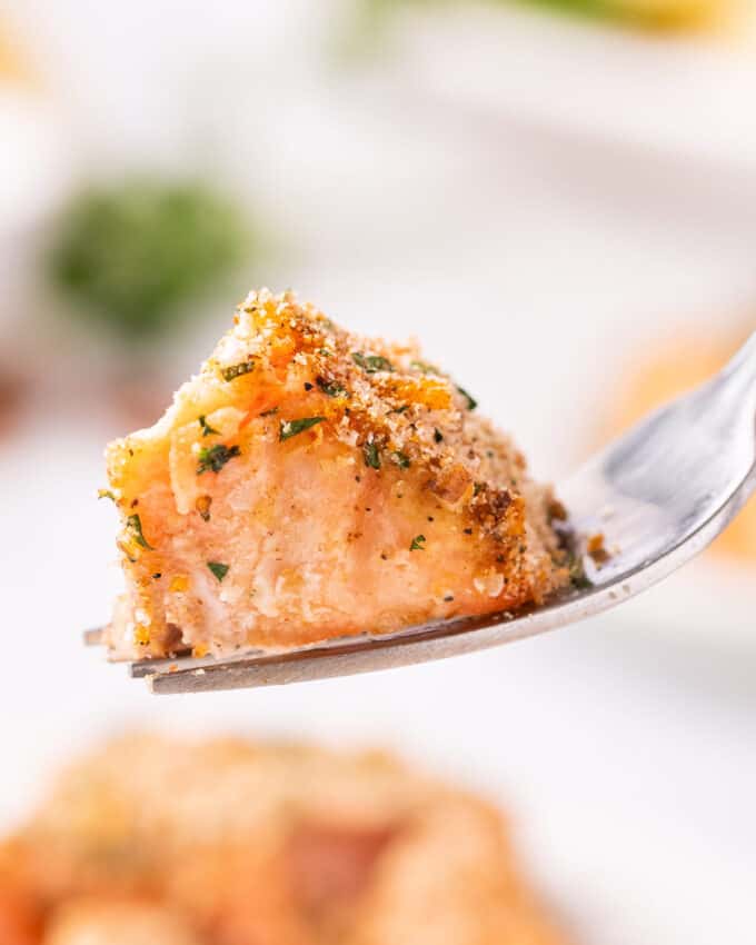 bite of baked salmon on fork