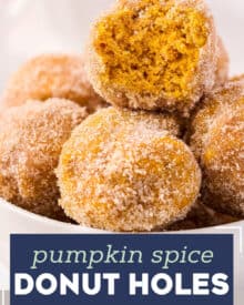 These light and fluffy pumpkin spice donut holes are baked instead of fried, and decadently dipped in butter and rolled in cinnamon sugar. They're the perfect Fall breakfast or treat! #pumpkin #donutholes #pumpkinspice