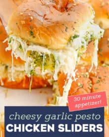 These Cheesy Garlic Pesto Chicken Sliders are gooey, hot, and so easy to make. Made with just 7 simple ingredients, with make ahead and freezer directions, they're the ultimate delicious party food! #sliders #pesto #chicken