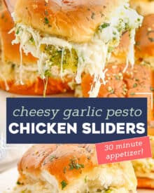 These Cheesy Garlic Pesto Chicken Sliders are gooey, hot, and so easy to make. Made with just 7 simple ingredients, with make ahead and freezer directions, they're the ultimate delicious party food! #sliders #pesto #chicken
