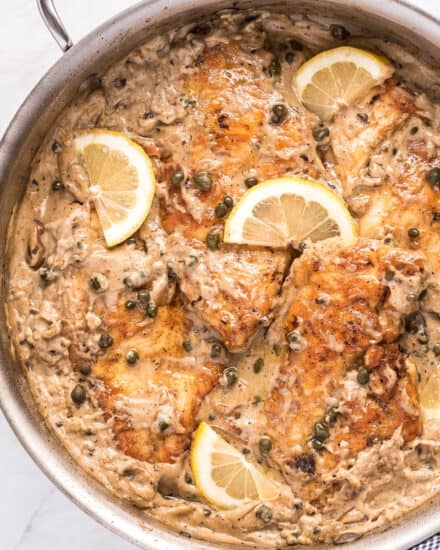 Tender chicken cutlets, lightly breaded and served in a mouthwatering lemon cream sauce with capers and shallots. Great over pasta and ready in about 30 minutes! #piccata #chicken #italian #30minutemeal