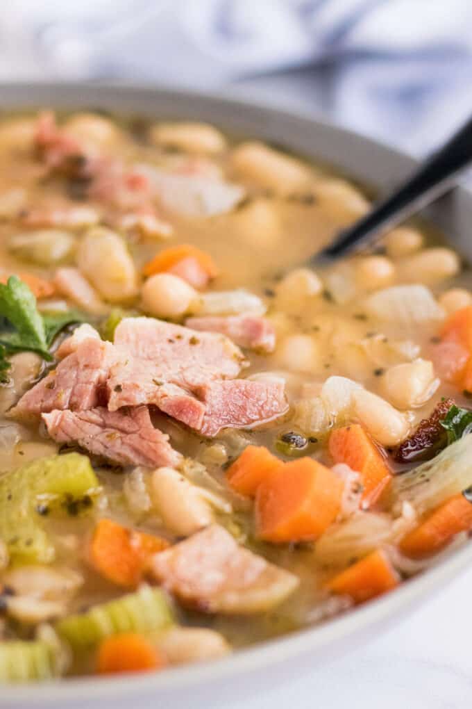 closeup of ham in ham and bean soup