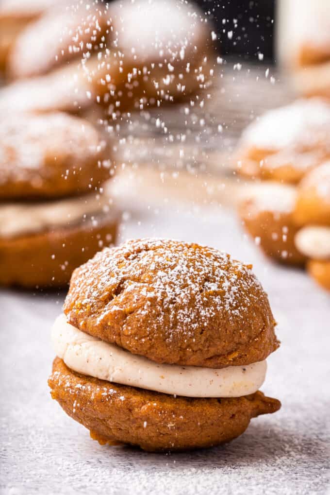 whoopie pie being dusted with powdered sugar