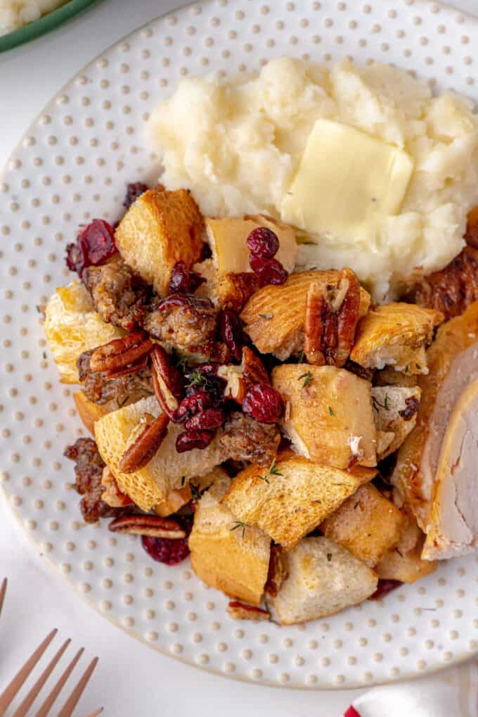 holiday stuffing on plate with turkey and mashed potatoes