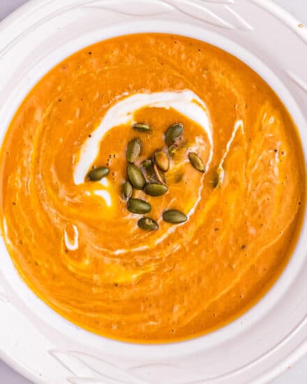 This Butternut Squash and Sweet Potato Soup is the ultimate in Fall and Winter comfort food. Roasting the squash and potatoes add such a deep caramelized flavor that is just unbeatable! The soup is also freezer-friendly! #soup #butternutsquash #sweetpotato #harvest