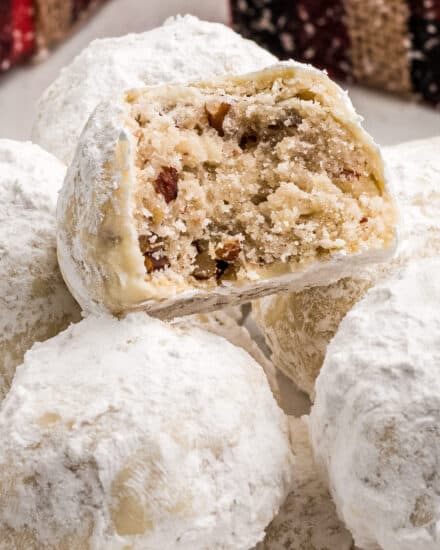 Snowball cookies are a classic holiday dessert made with simple ingredients, are buttery, nutty, and just melt in your mouth. Perfect for Christmas, or any other holiday, they'll be a family favorite on the dessert tray! #cookies #christmas #dessert #baking