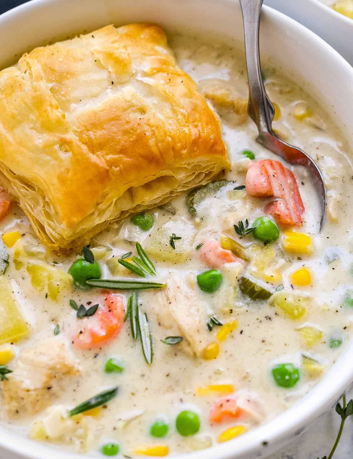 All the amazing savory flavors of a classic chicken pot pie, turned into a deliciously creamy, chowder-like soup! Chicken pot pie soup is a hearty dinner idea the whole family will love. #soup #chickenpotpie #chickensoup
