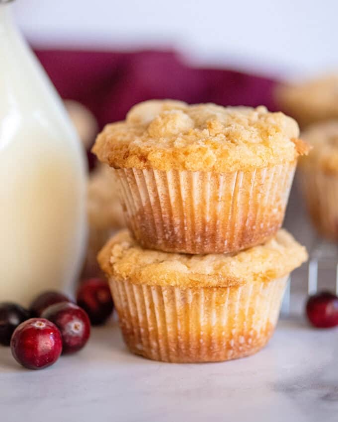 These bakery-style Crumble-Topped Cranberry Muffins are soft and tender, and bursting with sweet and tart cranberries in every bite! Perfect as a breakfast or snack, these muffins are also freezer-friendly. #muffins #cranberry #crumble #streusel