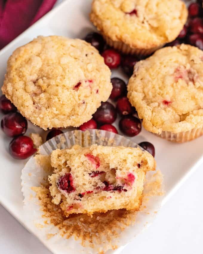 cranberry muffins on platter with cranberries
