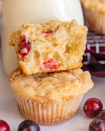 These bakery-style Crumble-Topped Cranberry Muffins are soft and tender, and bursting with sweet and tart cranberries in every bite! Perfect as a breakfast or snack, these muffins are also freezer-friendly. #muffins #cranberry #crumble #streusel