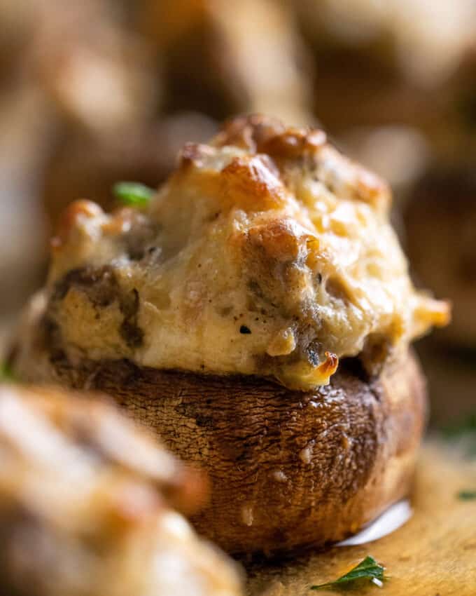 closeup view of creamy sausage stuffed mushrooms