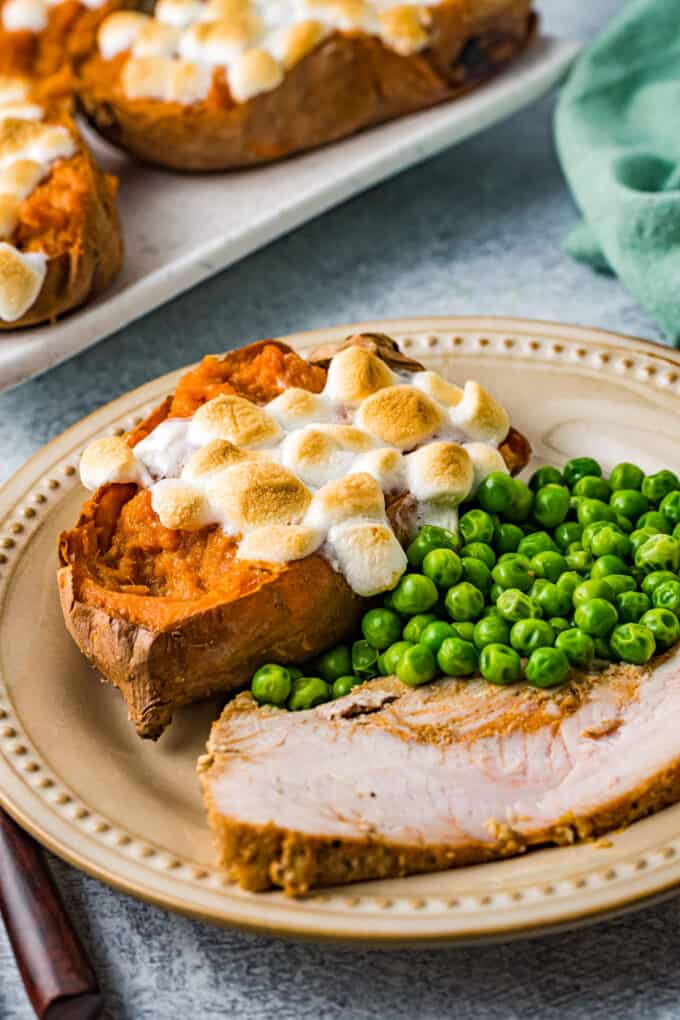 plate of holiday food with twice baked sweet potatoes