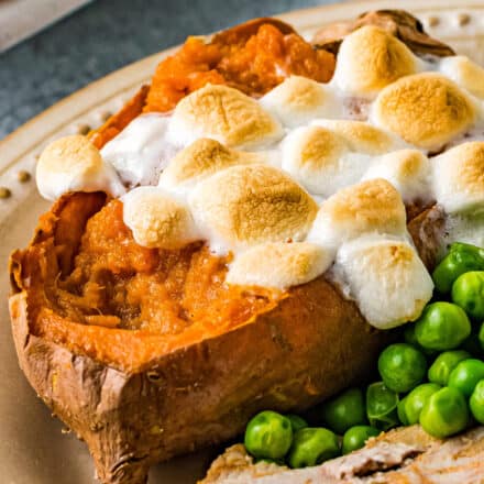 These Twice Baked Sweet Potatoes are perfectly sweetened with brown sugar, warm Fall spices, then topped with mini marshmallows. They're like amazing individual sweet potato casseroles, and perfect for the holidays! #sweetpotatoes #thanksgiving #sidedish