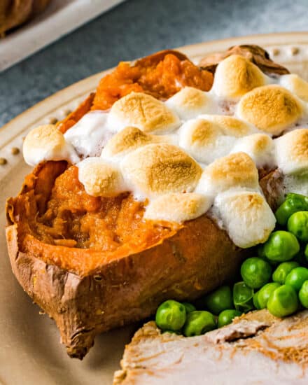 These Twice Baked Sweet Potatoes are perfectly sweetened with brown sugar, warm Fall spices, then topped with mini marshmallows. They're like amazing individual sweet potato casseroles, and perfect for the holidays! #sweetpotatoes #thanksgiving #sidedish