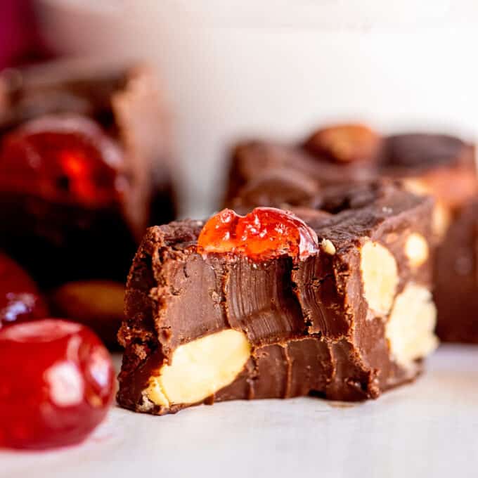 piece of cherry chocolate fudge with a bite taken out of it