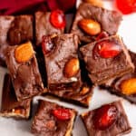 pile of chocolate fudge with cherries and almonds