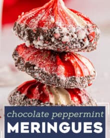 Crunchy and light meringue cookies are flavored with a hint of sweet peppermint, and swirled with red coloring. They are dipped in smooth chocolate and then sprinkled with peppermint pieces for flavor and crunch. #meringue #cookies #peppermint #baking