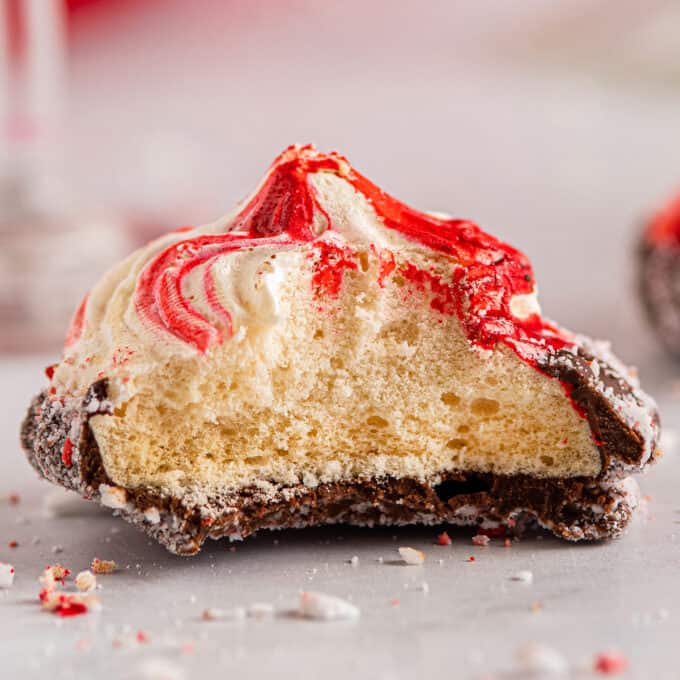 peppermint meringue cookie cut in half to show inside texture