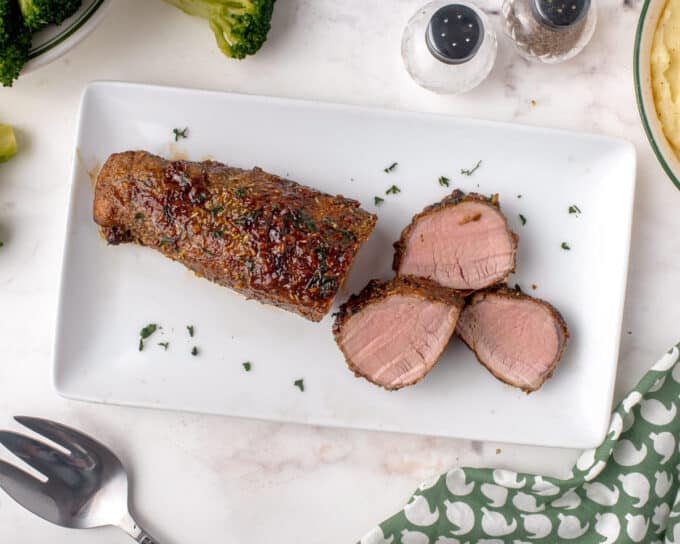 pork tenderloin and slices of white platter