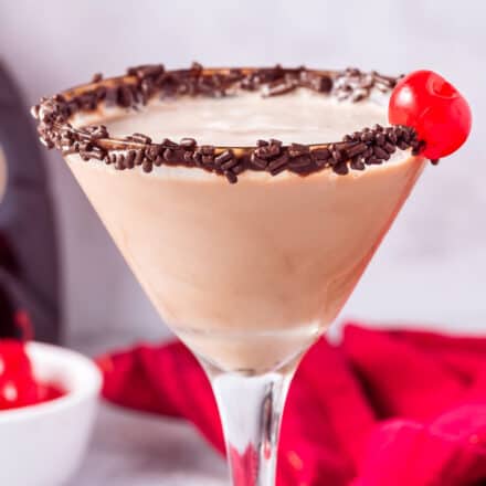 chocolate martini with chocolate sprinkles and cherry garnish