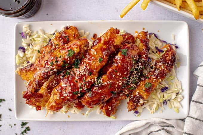 platter full of whiskey glazed fried chicken strips